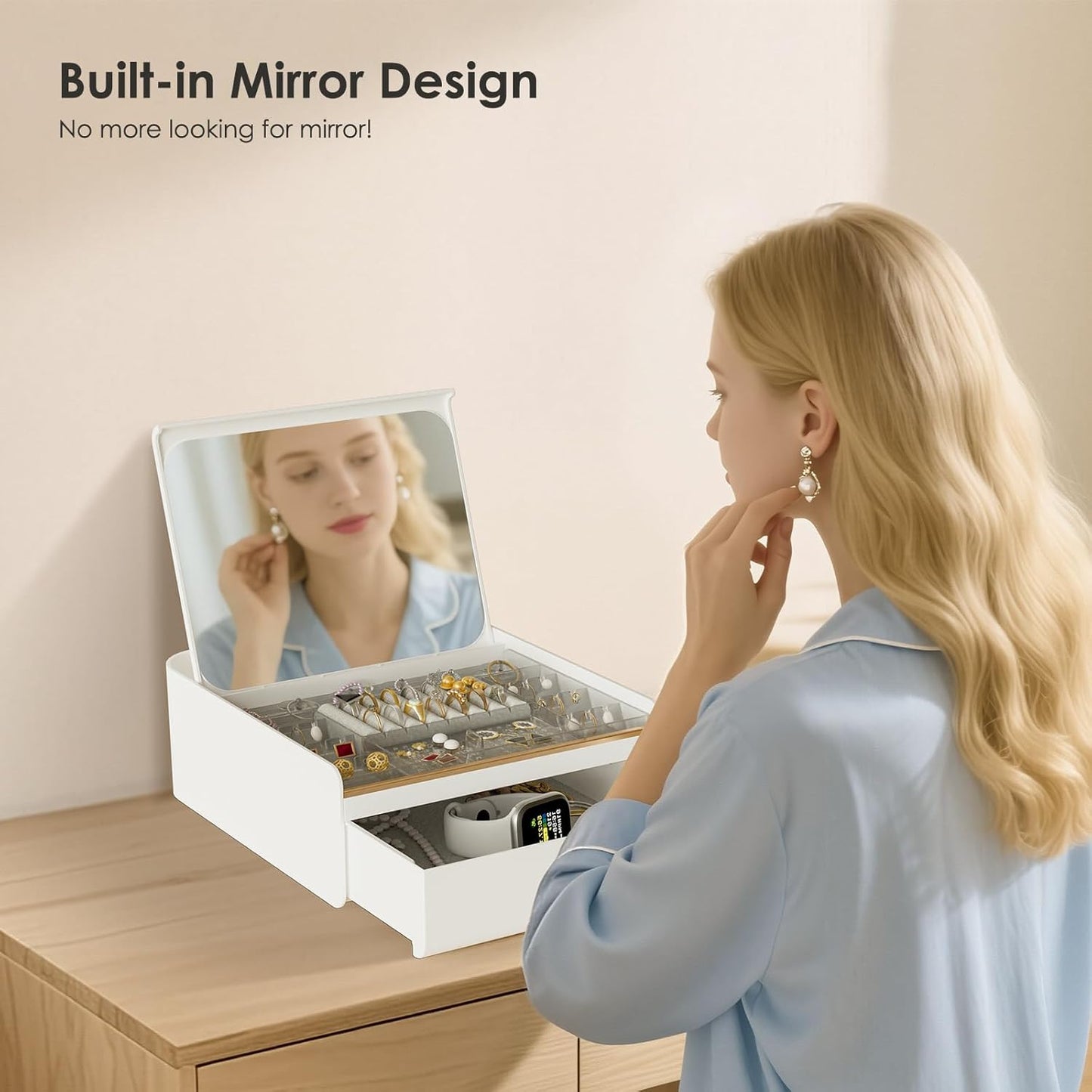 Woman using a jewelry box with a built-in mirror on a wooden surface.