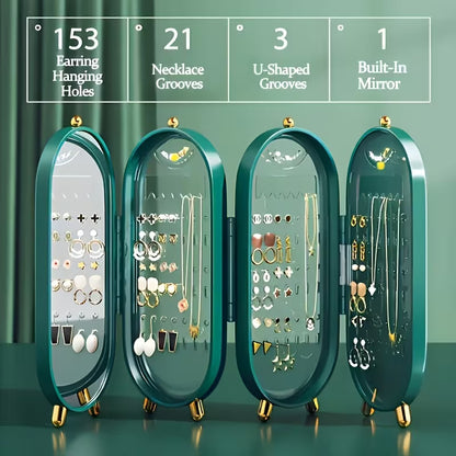 Green jewelry organizer with various earrings and necklaces on a green background
