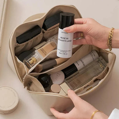 large travel cosmetic bag filled with makeup and skincare products